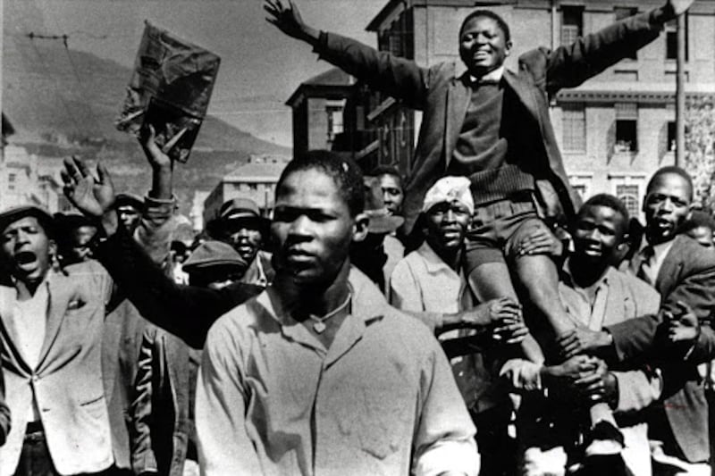 A young Philip Kgosana is carried shoulder-high by marchers in March 1960.